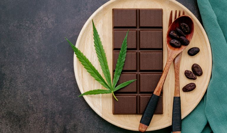 Bored of taking CBD the same old basic way? What if we told you there is a more fun way to enjoy the therapeutic advantages of cannabidiol, all while satisfying your cravings and treating your taste buds? Yes, you've read it correctly; a delightful way to enjoy the bitter taste of CBD, especially if you are a die-hard chocoholic! Presenting CBD-infused chocolates, a perfect delicacy combining delectable flavors and potential relaxation benefits. These decadent, velvety-rich treats are non-addictive and provide the health benefits of CBD without producing any side effects, making them a top-favorite choice for many CBD enthusiasts. Although pre-made CBD-infused chocolates by high-end vendors are available in the market, they are quite expensive. Knowing how to make them yourself is a cost-friendly solution that allows you to enjoy a more customized experience without breaking the bank. To help you make your own CBD-infused chocolates that guaranteed, will tantalize your taste buds and revitalize your mind and body, we have compiled an easy-to-follow guide. With step-by-step instructions, you can master the art of creating this delightful CBD-infused treat right in the comfort of your kitchen. Determining the Dosage for DIY CBD Chocolates While CBD-infused chocolates are tempting, and you may want to eat multiple in one sitting, not being wary of your intake quantity can risk overdosing on cannabidiol. To prevent this and ensure you receive benefits from a safe consumable amount, measuring the dosage of CBD before infusing it into your chocolate mixture is crucial. Start by checking the concentration of CBD in your preferred oil or extract measured in mg per ml. For example, if your CBD oil bottle has a fluid capacity of 30 ml and contains 600 mg of CBD, it means that per ml of the oil contains a CBD concentration of 20mg. Once you've calculated the per ml dosage of CBD in your oil or extract, the next step is determining how much is needed in each chocolate piece to acquire your desired dosage. For example, if you want each chocolate piece to contain 10 mg of CBD and the molding tray has 20 units, you would need 200 mg of CBD to make a single batch. Using the previous example that calculated the concentration of CBD per ml of oil, i.e., 20mg/ml, each batch of 20 chocolates would require 10 ml of CBD oil to achieve the desired dosage of 10 mg per piece. Remember that responses to CBD vary individually, so start with a lower dose and gradually increase if needed. Tempting Treats of Health: 3 Piece-of-Cake DIY CBD Chocolate Recipes You Need to Try DIY CBD-infused Chocolate Recipe #1 Ingredients 1 cup of high-quality dark or semi-sweet chocolate (or any chocolate you prefer) Few drops of your favorite CBD oil Supplies Required Microwave or double boiler Silicone spatula Silicone chocolate molding tray Instructions Begin by melting the chocolate in a microwave or double boiler. If using a microwave, heat the chocolate in short intervals and stir in between until completely melted. However, if using a double boiler, fill the bottom pot with water and bring it to a simmer. Place the chocolate in the top pot and gently stir it until melted and smooth. Be careful not to overheat the chocolate, as it can become grainy or burnt. When the chocolate is fully melted, take it off the heat and slightly cool it down. Add a few drops of your favorite CBD oil according to your desired dosage and stir thoroughly to ensure it is well mixed. Pour the CBD-infused chocolate mixture into the molding tray and tap it gently on the countertop to ensure even distribution and remove any air bubbles. Chill the filled molds in the refrigerator for at least an hour until set. Once solid, carefully remove the chocolates from the mold and store them in an airtight container in a cool place to enjoy them for days. DIY CBD-infused Chocolate Recipe #2 Ingredients 3 tbsp cocoa powder 3 tbsp powdered sugar 1 tbsp cannabutter Supplies Required Double boiler Sieve Silicone spatula Silicone chocolate molding tray Instructions To make cannabutter: Simmer water in a double boiler and melt unsalted butter in the top pot on low heat. Once the butter is melted, add a few drops of CBD oil or isolate according to your desired dosage and keep stirring until blended perfectly. Make sure the mixture does not come to a boil. Remove from heat and cool down to room temperature. Store the cannabutter in a cool, dry place for extensive use. To make cannabutter chocolate: Melt the cannabutter in a double boiler on low heat. Sieve cocoa powder and powdered sugar into the melted butter to avoid clumps, and keep stirring to prevent the mixture from burning. You can also add honey or a different sweetener instead of powdered sugar to enhance the taste. Once the right consistency is achieved, remove from heat and pour the mixture into the mold. Tap the mold to remove air bubbles and ensure even distribution. Place it in the refrigerator for at least two to three hours to harden. Once frozen, remove the chocolates from the mold and store them in a cool place inside an airtight container. DIY CBD-infused Chocolate Recipe #3 - Vegan-friendly Ingredients ½ cup virgin coconut oil or cacao butter CBD oil or isolate (according to your preferred dosage) 1 cup pure cacao powder 4 tbsp date syrup or any preferred natural vegan sweetener 1 tsp vanilla extract Supplies Required Double boiler or saucepan Sieve Spatula Silicone chocolate molding tray Instructions Melt coconut oil or cacao butter in a double boiler or a saucepan over low heat. Once liquid, remove the oil from the heat. Sieve cacao powder into the oil/melted butter and add CBD oil/isolate, date syrup, and vanilla extract. Remember to stir the mixture continuously until a smooth, fully blended texture is achieved. Slightly cool the mixture to room temperature and pour it into the molds tray. Tap the tray for even distribution and to remove air bubbles from the mixture. Chill the chocolate-filled molds in the refrigerator for two to three hours. Remove them once frozen and store them in the fridge in an airtight container to maintain freshness. Elevate Your CBD-infused Chocolates: How to Make Them Irresistibly Exciting What makes DIY CBD-infused chocolate recipes the best are the endless possibilities when it comes to customizing them. To make the above recipes more exciting for your tastebuds, all while reaping the health benefits of CBD, here are some tips you can consider: Experiment with Unique Flavor Combinations Even though adding CBD to plain chocolate can be an enjoyable experience, adding a bit of flavor can create a more delightful experience. Consider experimenting with various flavor combinations and discover the ones you love the most to use in your next batches. You can shred a bit of orange or lemon zest into the CBD-infused chocolate mixture to add a hint of citrus or incorporate exotic flavors like lavender, chili, sea salt, or matcha for a burst of unique taste. Play with Textures Incorporating different textures into your CBD chocolate can enhance the overall experience and make it more enjoyable. Mix ingredients like toasted seeds, caramelized nuts, granola, or crushed cookies to experience a satisfying crunch in every bite you take. You can also make your CBD-infused chocolate mixture more decadent by swirling in some hazelnut spread or peanut butter. Infuse with Essential Oils Infusing your chocolate mixture with essential oils not only imparts a hint of refreshing flavors but also adds to the incorporated CBD's soothing effects. Put in a drop or two of your favorite essential oil, like peppermint or citrus oils, and enjoy a relaxing sensation while you nibble on a piece of flavorsome CBD chocolate. Decorate with Edible Accents CBD-infused chocolates don't have to look plain and boring. Elevate how your chocolate pieces look and add a personalized touch of fun and color by decorating them with edible accents. Use colorful sprinkles, crushed peppermint candies, edible glitter, dehydrated fruits, or even edible flowers to make the chocolates feel like a more special treat. Potential Benefits of CBD-infused Chocolates Besides masking the bitter taste of hemp in CBD oils and extracts and offering a more appetizing intake route, CBD-infused chocolates deliver several health benefits. Chocolate, especially dark chocolate, is rich in polyphenols and flavanols, which are strong antioxidants that protect the body from free radicals and prevent oxidative stress. These antioxidant effects are enhanced when paired with CBD, providing additional health benefits. CBD's mood-enhancing and relaxing properties are amplified when infused with chocolate, as it is high in tryptophan, which regulates serotonin levels, and theobromine which also stabilizes mood and energy levels. CBD chocolates, therefore, can help promote better sleep and manage stress and anxiety. The fat content in chocolate can also aid in extending CBD's duration of action, allowing one to experience its potent analgesic and anti-inflammatory effects for longer. Conclusion Making CBD chocolates at home is a budget-friendly and delectable way to enjoy your daily cannabidiol intake. They are the perfect treat, combining the satisfying richness of cocoa with the amazing therapeutic benefits of CBD. Using our three easy-to-follow DIY recipes in this guide, you can master crafting these healthy, delicious treats every time. So gather your ingredients, put on your apron, and embark on the journey to create your very own batch of mouthwatering CBD-infused chocolates!,CBD-infused Chocolates