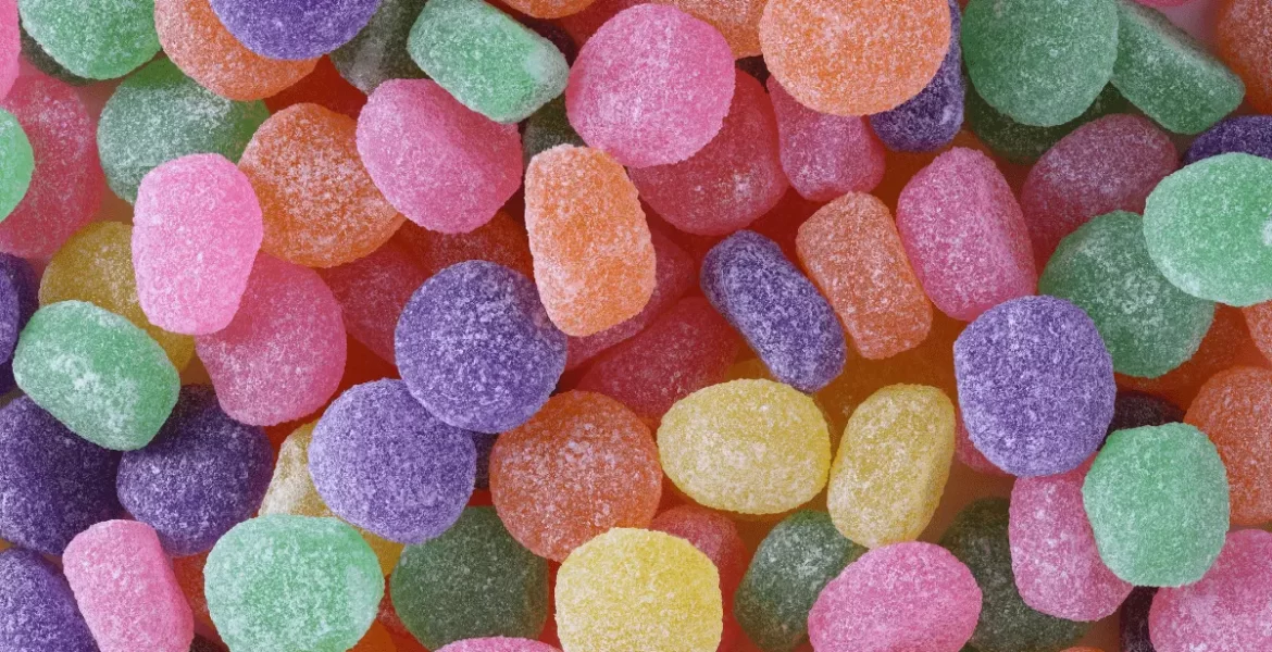 A pile of gummies with a variety of vibrant colors.